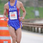 Utah Vallley Marathon Man with glasses purple running suit